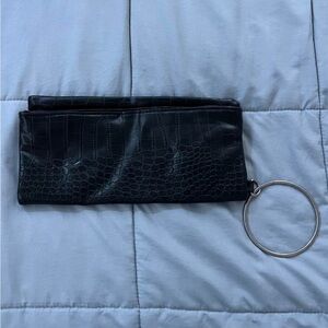 black clutch bag that folds out into a bigger handbag!